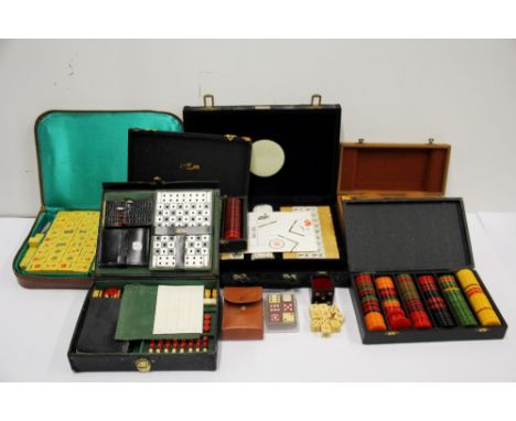 A quantity of vintage boxed games and gaming counters including two Mah-jong sets.