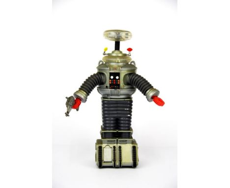 A 1997 New Line productions mechanical Robot toy, from Lost In Space.  H. 27cm.