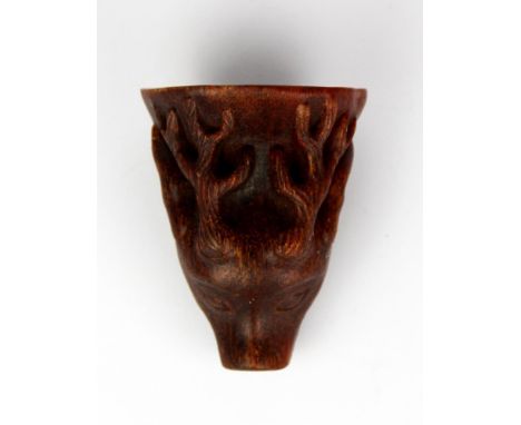 A Chinese carved horn libation cup, H. 9.5cm.