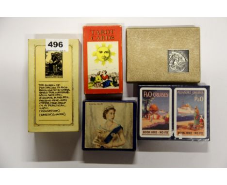 Two packs of Tarot cards, two packs of playing cards and a proud heritage note book.