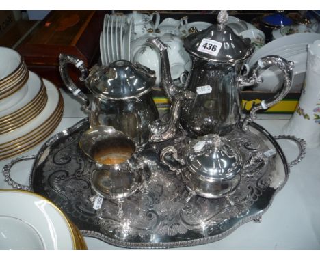 A FOUR PIECE SILVER PLATED TEA SERVICE, on a twin handled footed tray (5)