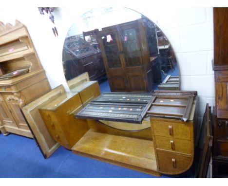 AN ART DECO MAPLE DRESSING TABLE, with circular mirror and glass shelf flanked by two banks of three drawers, approximate siz