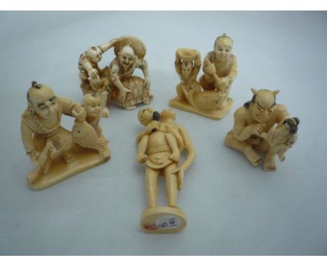 FIVE  NETSUKE, all depicting men with children, together with a demon netsuke, largest measuring 4.5cm x 5cm, all signed