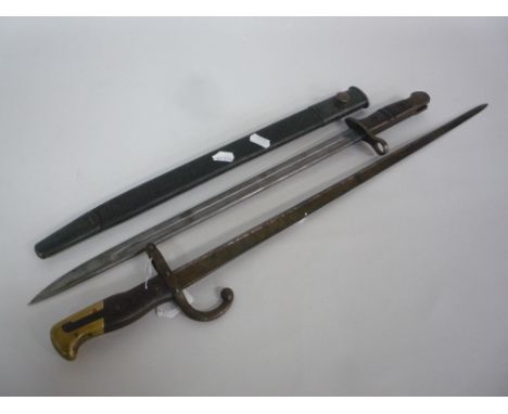 A WW1 1913 REMINGTON BAYONET, marked 10 16 with it's scabbard, together with a 1907 bayonet with hook (2)