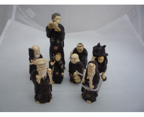 EIGHT NETSUKE, all depicting gods, together with a woman with a dove, largest measuring 12 x 4cm, all signed