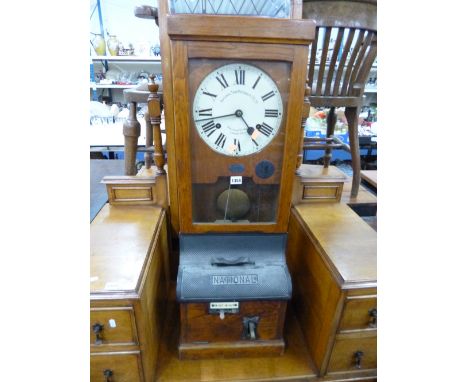 A 'NATIONAL TIME RECORDER CO LTD' , oak cased clocking in machine