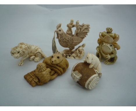 FIVE NETSUKE, all of animals, to include a snuff bottle, largest measuring 5cm x 5cm, all signed