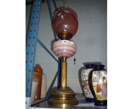 A VICTORIAN BRASS CORINTHIAN COLUMN OIL LAMP, glass shade with marbled effect glass reservoir , height approximately 47cm (no