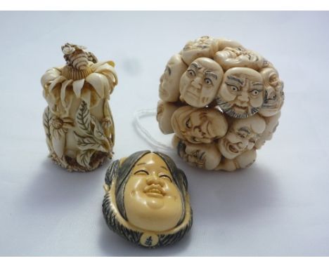 THREE NETSUKE, to include a netsuke comprising of many faces, a double face and a scent bottle, two signed