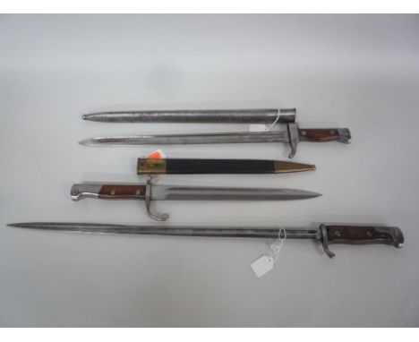 A MAUSER SPEARPOINT BAYONET, together with another Mauser bayonet and scabbard and a Weyersberg Kirschbaum and Cie Solingen b