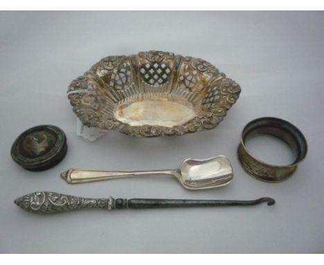 A COLLECTION OF SILVER, to include napkin ring, pierced repousse scrolled dish, lid, spoon, button hook etc, 2.7ozt (5)