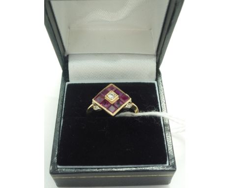 A RUBY AND DIAMOND RING, with central brilliant cut diamond within a surround square shape rubies, with diamond foliate sides