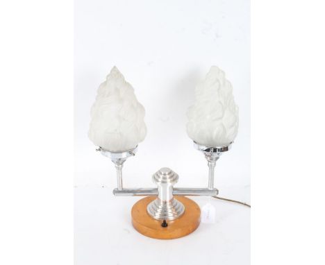 Art Deco chrome twin branch lamp, having two frosted glass shades of textured conical form, the chrome branches raised on a s