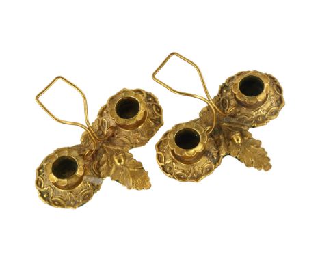 A pair of Regency solid cast gilt-bronze twin-sconce candle stands, with relief moulded acorn designs, width 13cmGood conditi