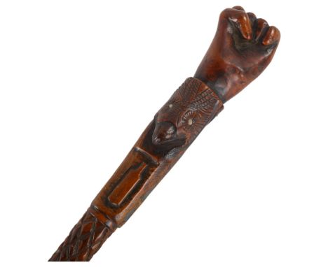 An ornately carved 19th century Folk Art walking stick, with inlaid metal playing card design motifs, the handle in the form 