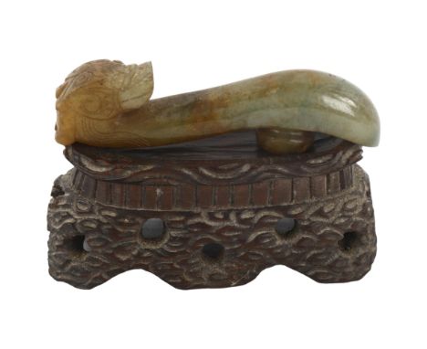 A Chinese carved jade dragon design buckle on hardwood stand, length 8cmGood condition 