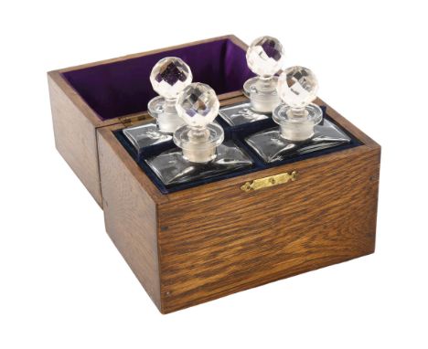 A set of 4 Vintage Rimmel glass perfume bottle and stoppers, in original inlaid wood case, case width 16cmPerfume bottles are