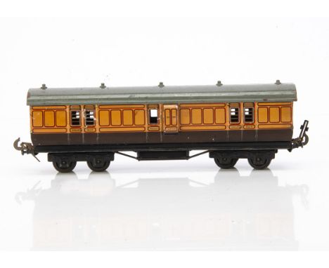A Carette for Bassett-Lowke 0 Gauge LSWR Full Brake Bogie Coach, in lithographed LSWR salmon pink/chocolate livery as No 133,