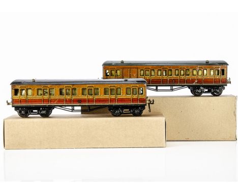 Two Hornby 0 Gauge Metropolitan Railway Coaches, both in lithographed 'Met' finish with large drop-link couplers, interior li