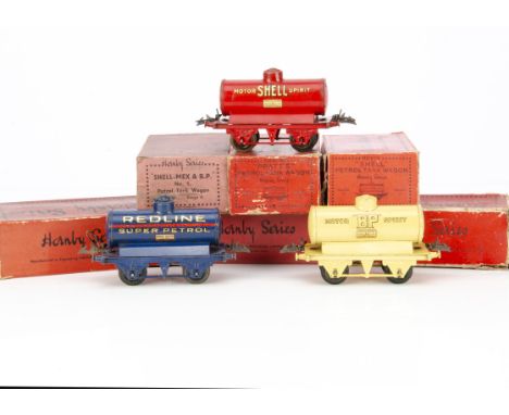 Boxed Pre-war Hornby 0 Gauge Tank Wagons, comprising cream 'Motor BP Spirit' (2), red 'Shell' (2), blue 'Redline-Glico' and '