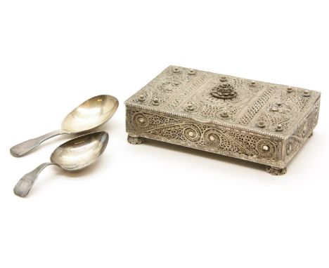 An Indian white metal filigree box, 12cm wide, together with two Georgian silver caddy spoons, one with heart shaped bowl (3)