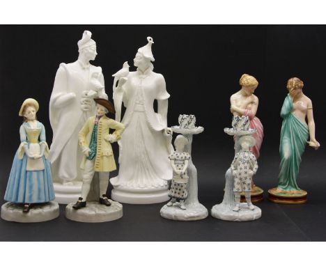 A pair of Royal Worcester figural candlesticks, and further figures