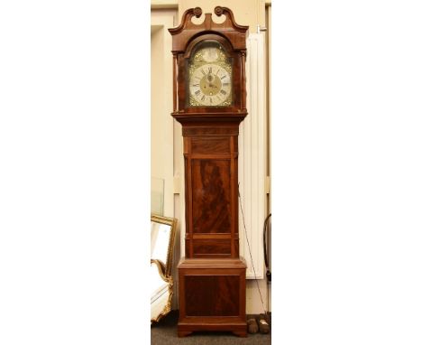 A George IV mahogany long case clock, the arched dial with a silvered chapter ring inscribed Jonathan Underwood, London, with