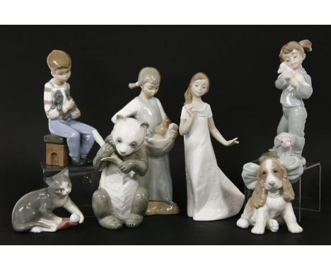 A collection of Nao figures, including a panda, a kitten playing ball, a spaniel with large bow, a singing lady etc (7)