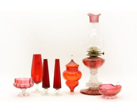 A Wright & Butler cranberry glass oil lamp, together with a collection of cranberry ware, to include a pair of bud vases etc 