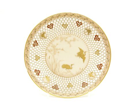 A Worcester reticulated plate, decorated with cranes in flight, with gilt highlights, and puce back stamp, 21cm diameter