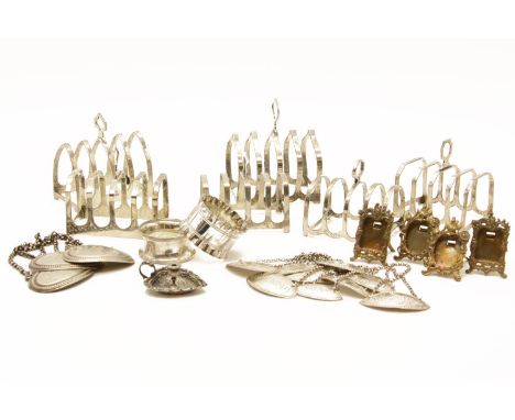 Six silver toast racks, three silver wire labels, and nine oval labels, miniature easel back photo frames, a miniature chambe