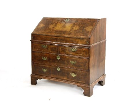 A walnut and feather banded bureau, 18th century with two short and two long drawers, on bracket fees, 92cm wide, 53cm deep a