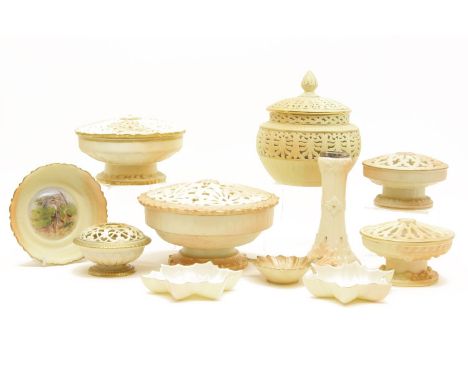 Grainger & Co Worcester blush ivory potpourri's, a double walled reticulated vase and cover, and four dishes