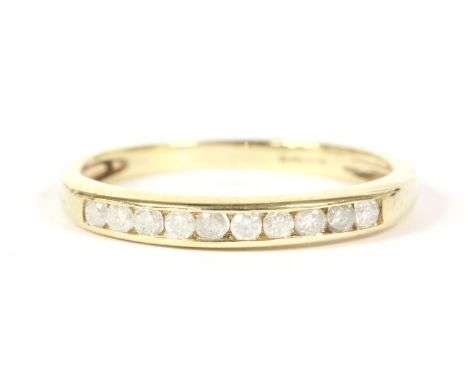 A 9ct gold diamond set half eternity ring, finger size K½1.24g