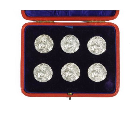 A cased set of six Art Nouveau silver buttons, impressed image of a maiden playing a harp, Birmingham 1904, M. Bros