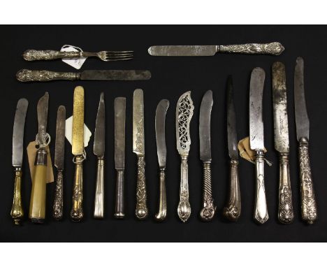 The Bill Brown cutlery collection: 16 silver handled knives, 5 with silver blades, and one fork.