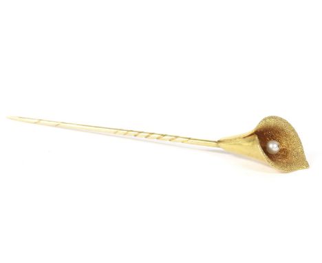 A cased gold Art Nouveau Arum Lily stick pin, with single stone to centre and textured interior in a P. M. Hatford & Sons box