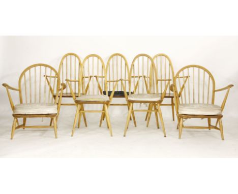 A set of five Ercol dining chains, with arms, and a pair of lounge chairs