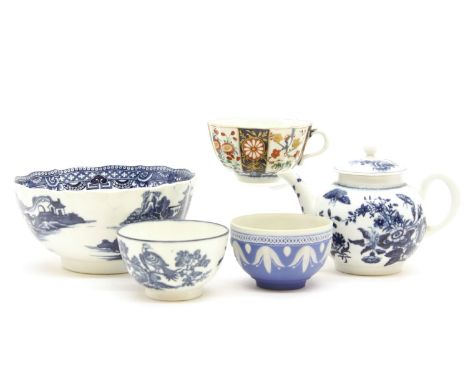 A Worcester porcelain first period bullet shaped tea pot, decorated in floral pattern, with associated cover, together with a