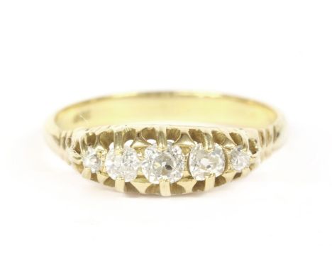 A gold graduated five stone diamond ring, marked 18ct2.98g