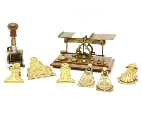 Brass postal scales and weights, six brass advertising letter clips, including 2 by Merry, Phipson and Parker , and a date st