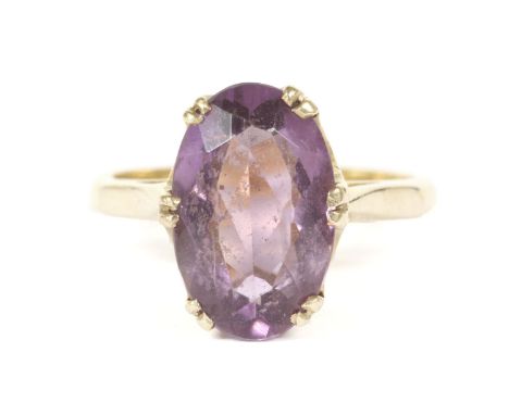 A gold single stone oval cut amethyst ring, (ignore markings, later replacement shank)4.65g