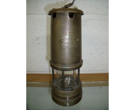 Brass miners style lamp with company plaque 
