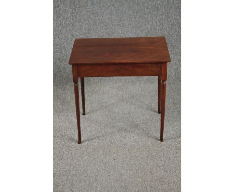 A 19th century mahogany lamp table on slender turned tapering supports. H.50 W.54 D.38cm. 