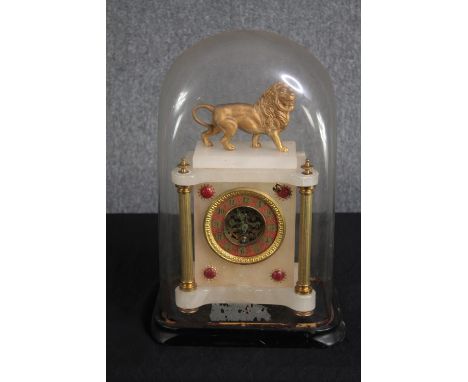 A nineteenth century French gilt metal and marble glass domed mantle clock. H.45 W.30 D.20 cm. 