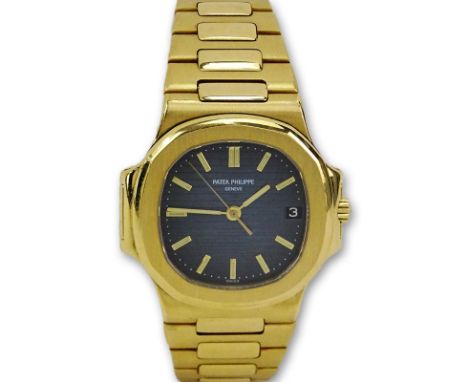 Man's Patek Philippe Nautilus 18 Karat Yellow Gold Automatic Movement Watch with Black Dial. Designed by Gerald Genta. Ref. #