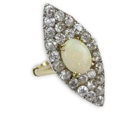 Victorian Old European Cut Diamond, Opal, Platinum and 18 Karat Yellow Gold Ring. Unsigned. Good antique condition. Ring size