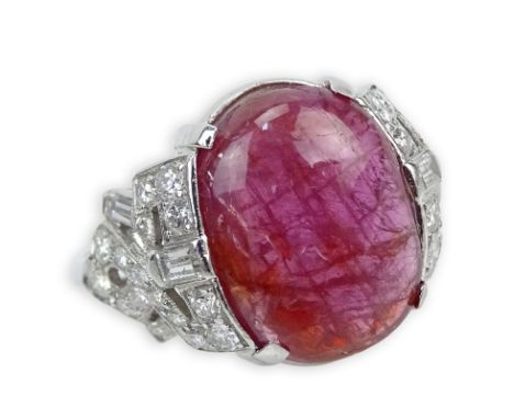 Lady's Art Deco Cabochon Ruby, 1.10 Carat Diamond and Platinum Ring. Ruby measures 15mm x 11.5mm. Diamonds F-G color, VS1-VS2