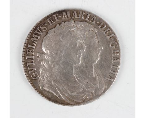 A William and Mary half-crown 1689, edge detailed 'Primo'.Buyer’s Premium 29.4% (including VAT @ 20%) of the hammer price. Lo
