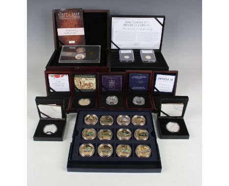 A large collection of silver and base metal commemorative coins, including a Westminster Mint silver Inaugural one pound two-